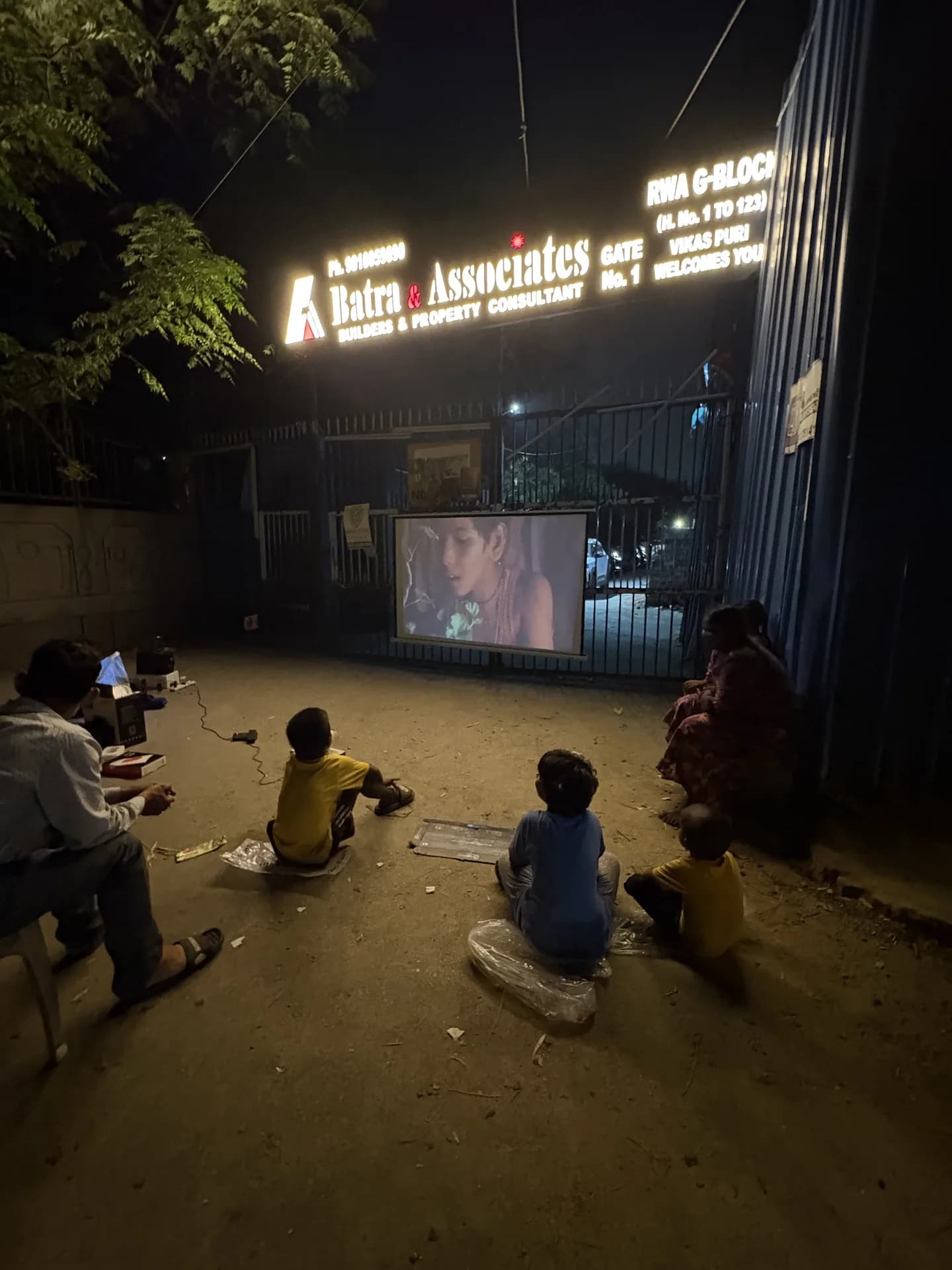 Children and neighbours gathered for a film evening