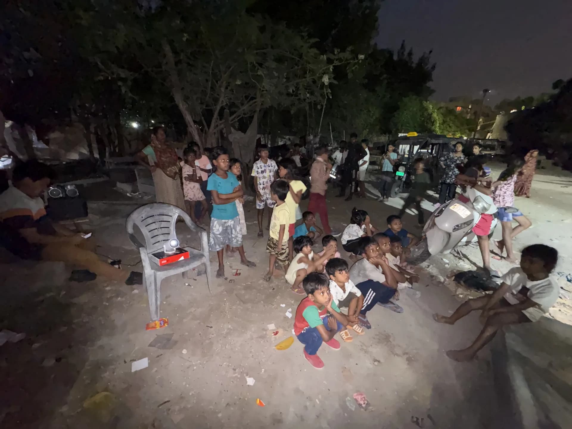 Equipment and volunteers preparing an open-air cinema