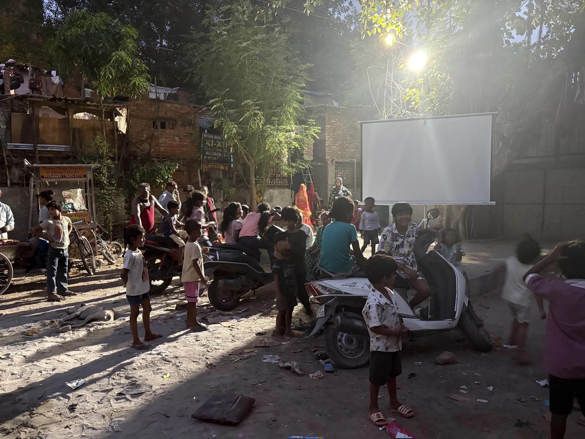 Children watching a film, faces lit by the screen